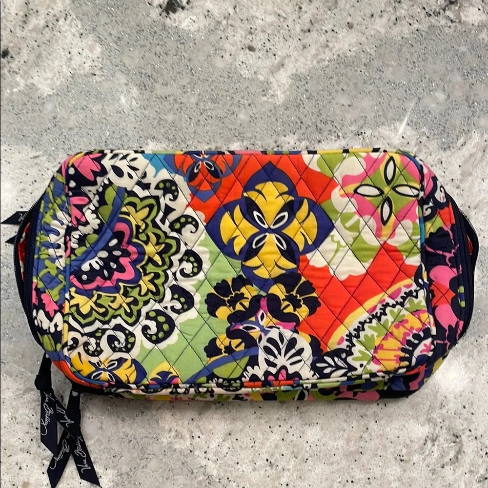 Vera Bradley travel toiletry bag with brush compartments.